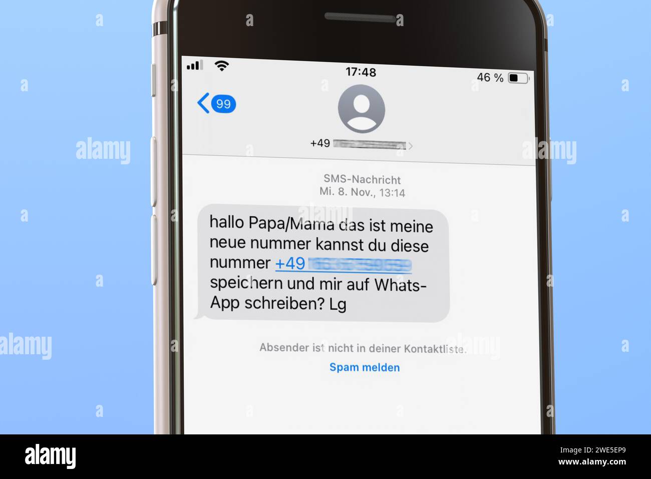 Phishing message in German on a smartphone. Telephone numbers
