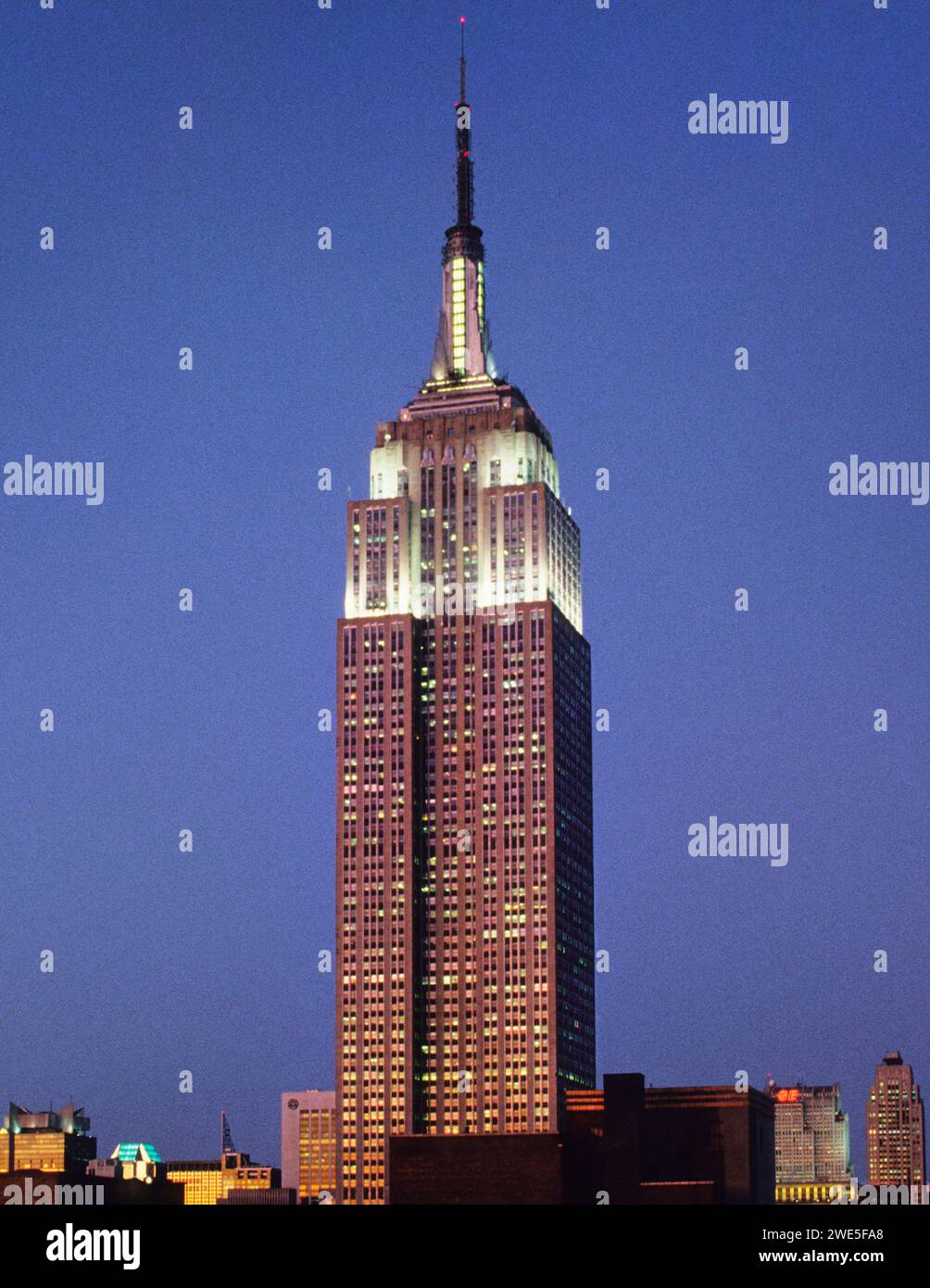 Empire State Building New York night. Midtown Manhattan Art Deco office building skyscraper USA Vertical Stock Photo