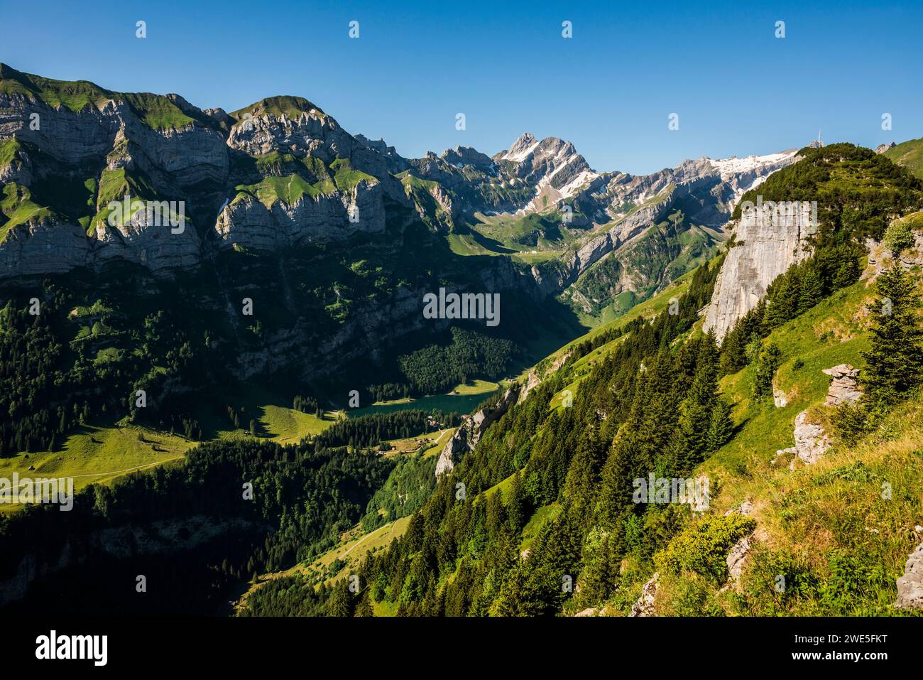 Steep mountains and lake, Seealpsee, Wasserauen, Alpstein, Appenzell Alps, Canton of Appenzell Innerrhoden, Switzerland Stock Photo