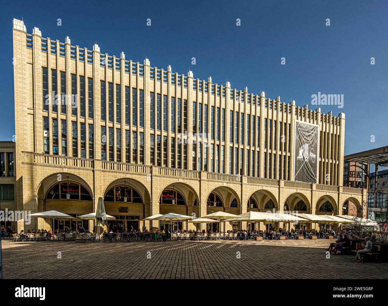 Facade of the Galerie Roter Turm shopping center by architect Hans Kollhoff (2000) with outdoor dining in the city center of Chemnitz, Saxony, Germany Stock Photo