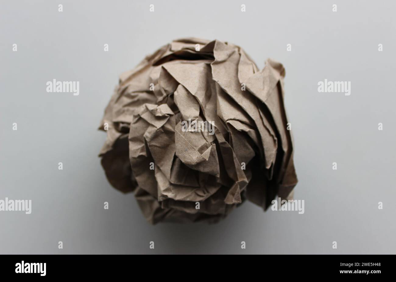 Pulp industry. Used wrapping paper ball isolated on white closeup view Stock Photo