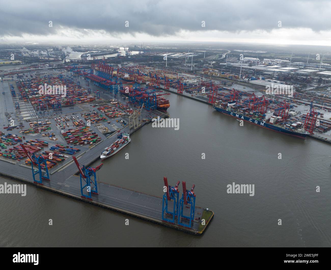 Hamburg, Germany, December 30th, 2023: Hamburg container terminal. Seaport on the river Elbe in Hamburg, Germany, 110 kilometresfrom its mouth on the Stock Photo