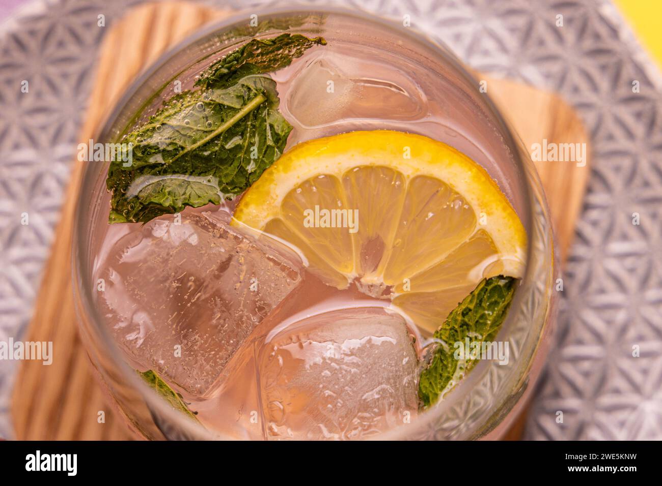 Gin tonic with mint and lemon slice as garnish Stock Photo Alamy