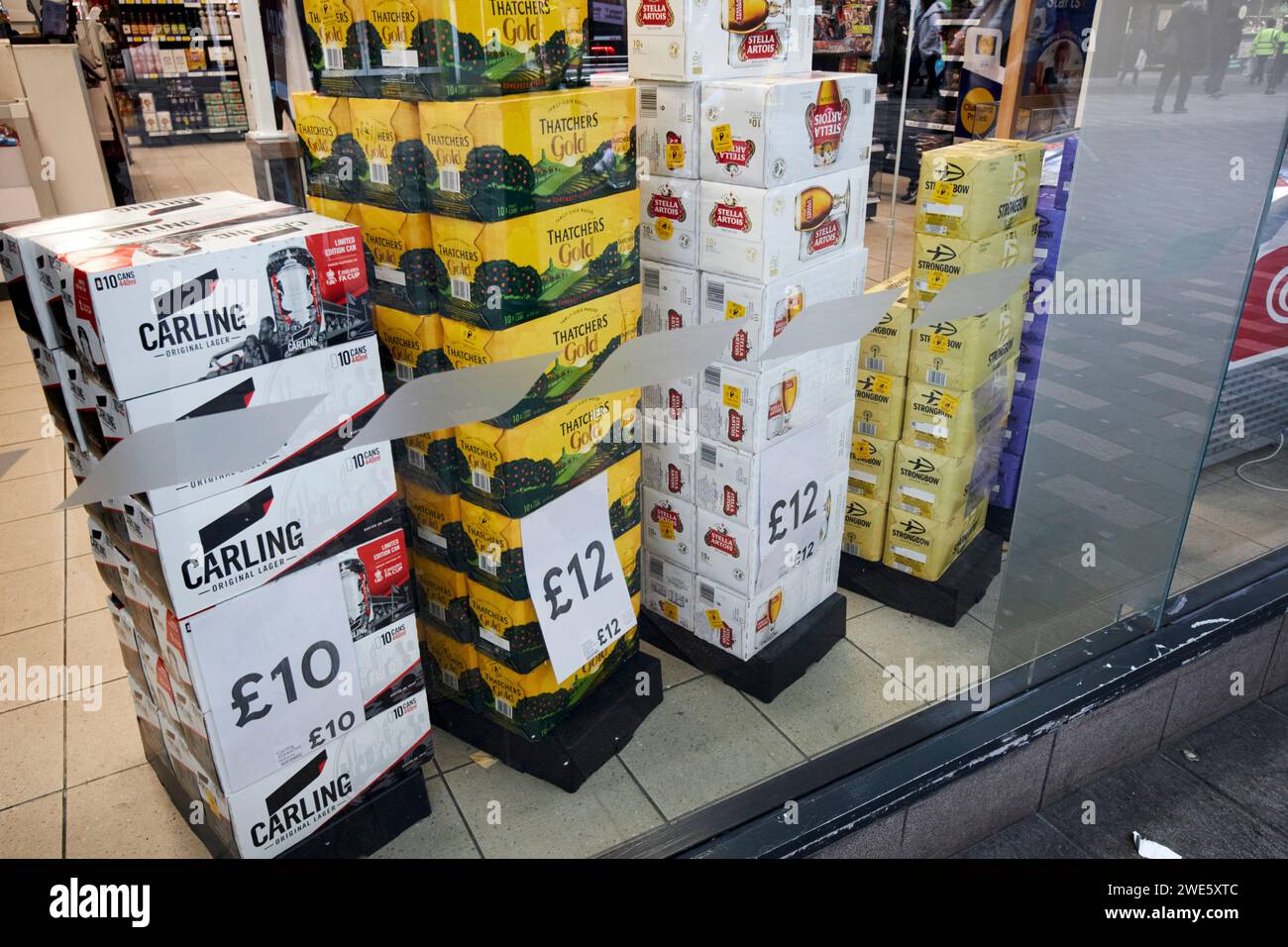 cartons of beer for sale on offer in the shop window of a tesco store city centre liverpool, merseyside, england, uk Stock Photo