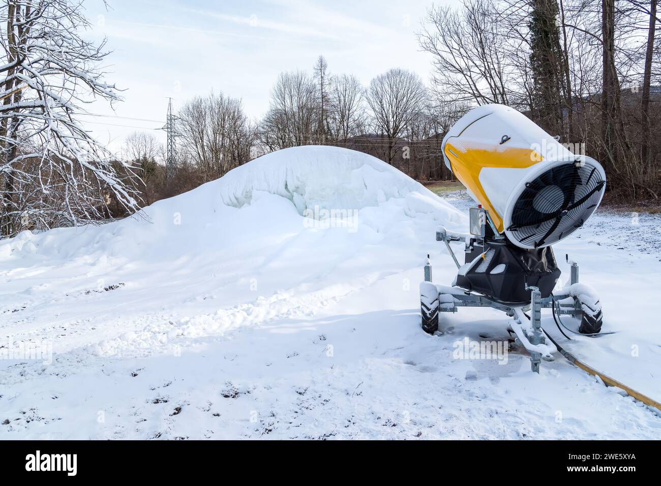 Snow cannon for producing artificial snow for ski slopes. Artificial snow system. Stock Photo