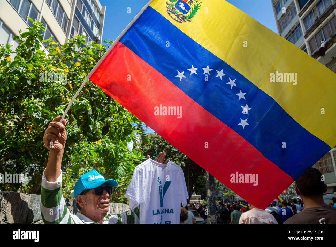 An opponent with the Venezuelan flag and a cap of Maria Corina Machado's Vente party. Rally of the candidate Maria Corina Machado, Venezuelan oppositi Stock Photo