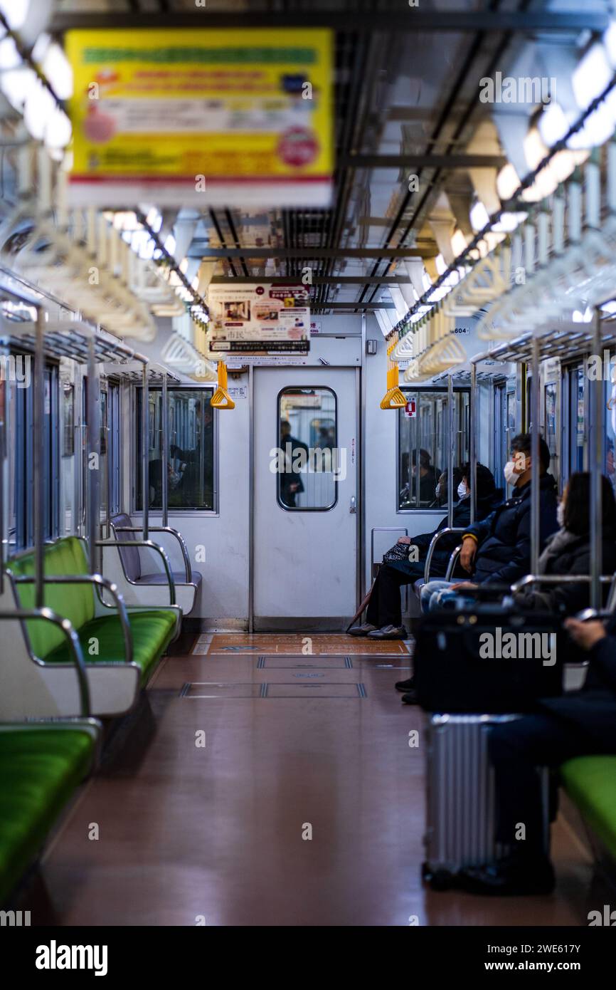 Empty train cars with green seats on one side Stock Photo Alamy