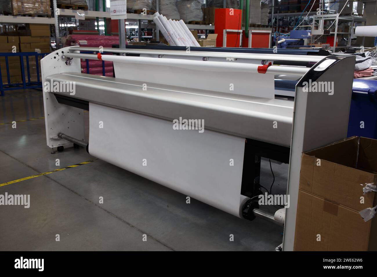 Wide-format inkjet printer plotter. Large industrial monochrome plotter for printing patterns and layouts from CAD in the preparation of production in Stock Photo