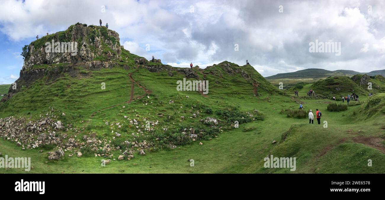 Landscape around Faerie Castle (Castle Ewen) at the Fairy Glen in Isle of Skye in Scotland, UK with unrecognizable tourists Stock Photo