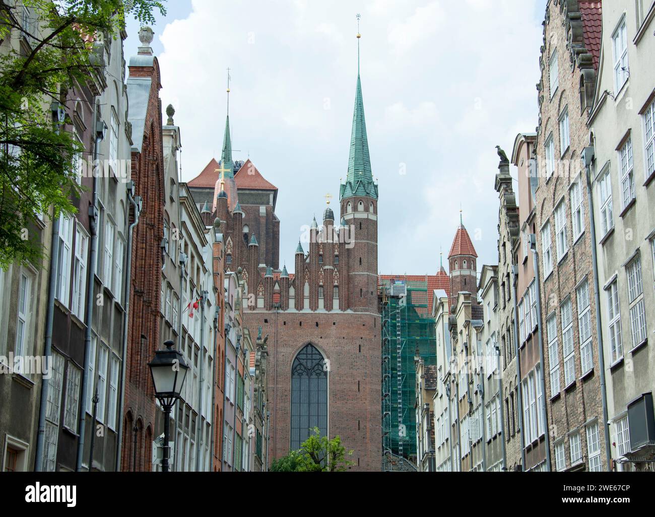 The view of Gdansk old town houses and the part of 16th century St. Mary's Catholic Church (Poland). Stock Photo