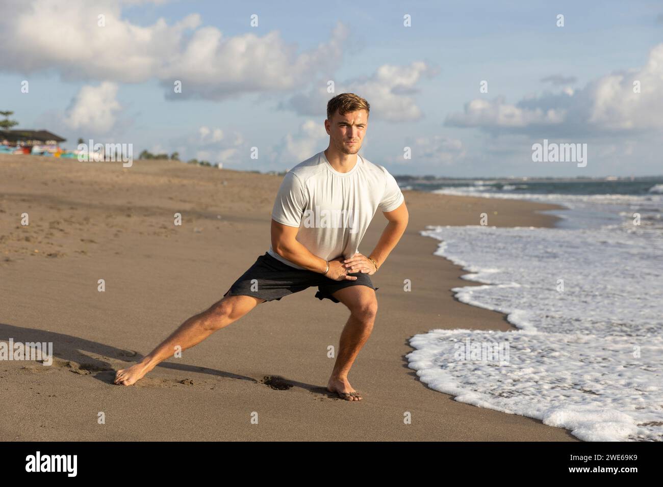 Beach stretching man hi-res stock photography and images - Alamy