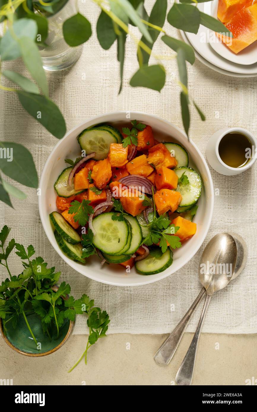 Mexican papaya salad with cucumber and red onions Stock Photo