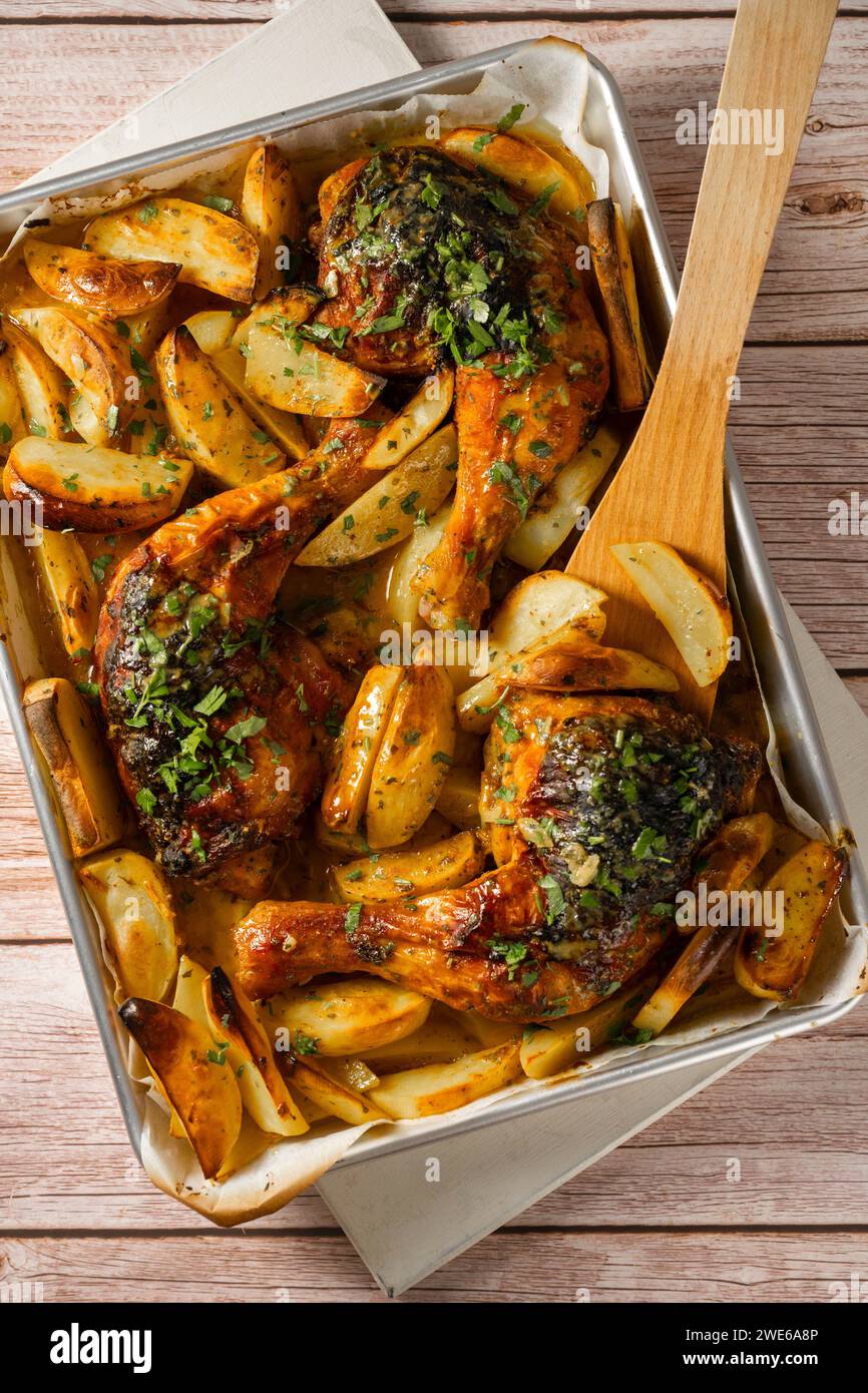 Oven baked chicken with potato wedges Stock Photo