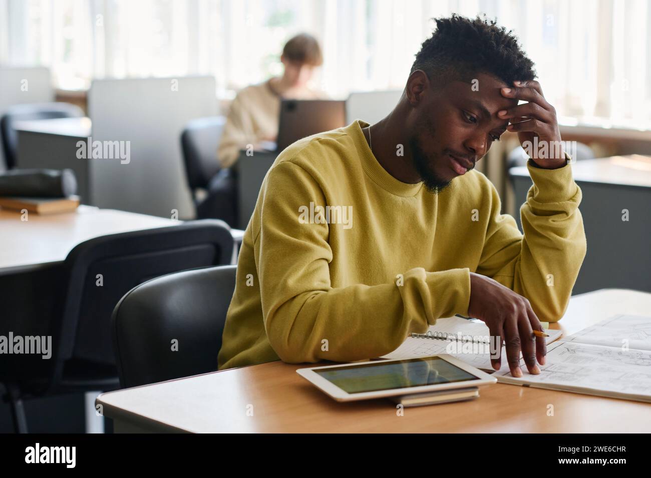 Black man studying in library hi-res stock photography and images - Alamy
