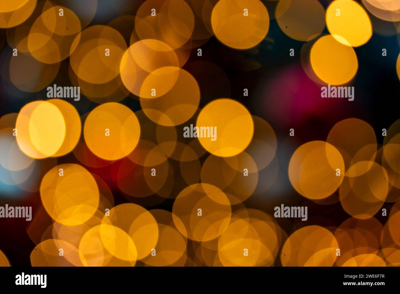 Orange glowing defocused Christmas lights Stock Photo