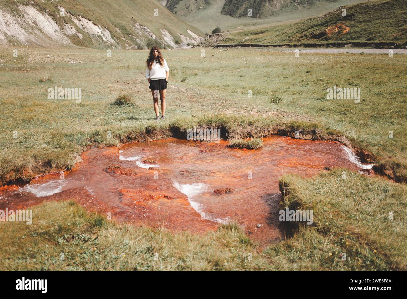Woman standing near lake in hi-res stock photography and images - Alamy
