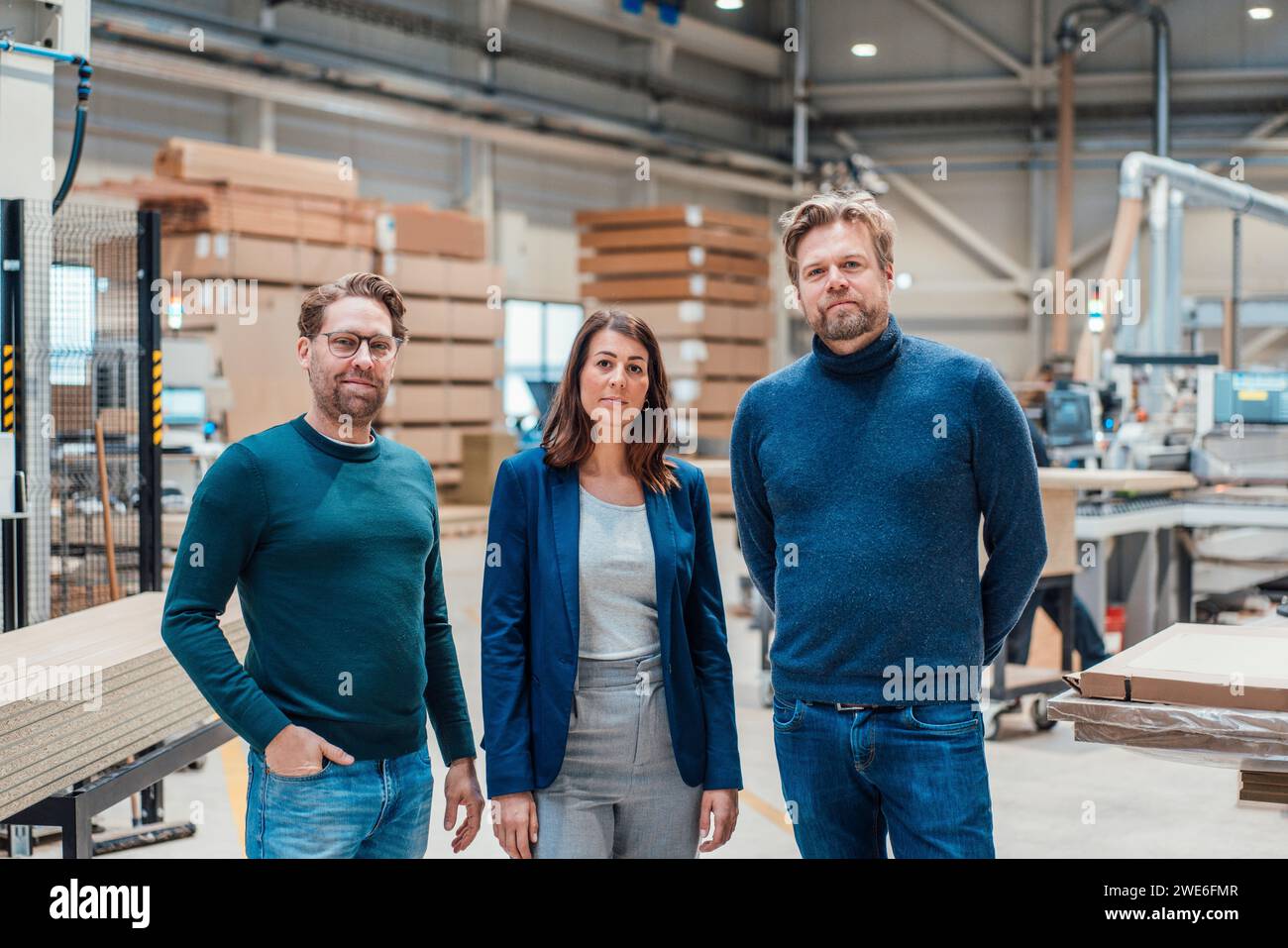 Confident architects standing in industry Stock Photo
