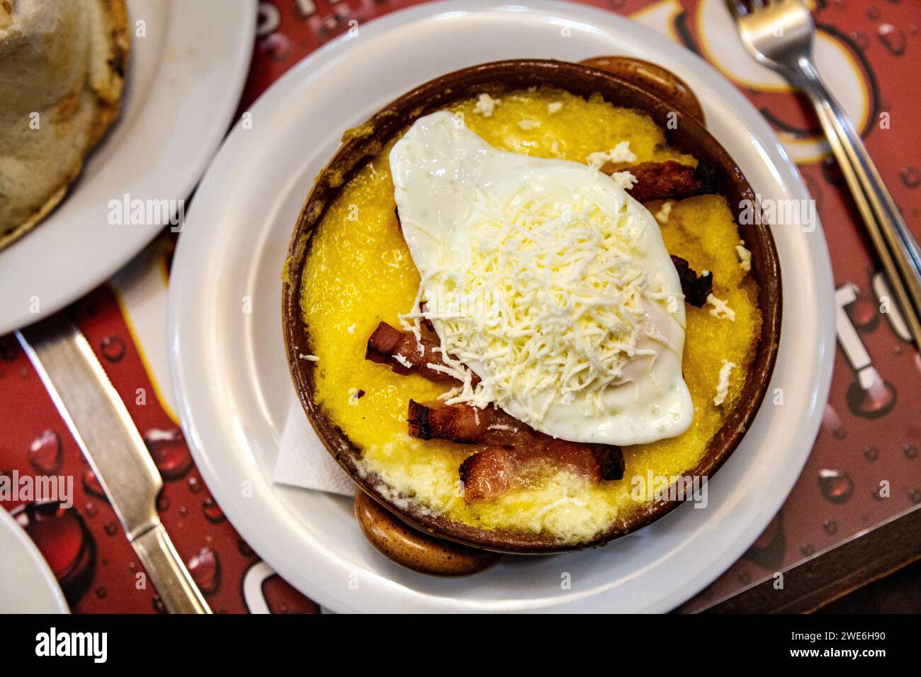 Traditional Romanian Bulz With Polenta Cheese Egg And Bacon At Casa 