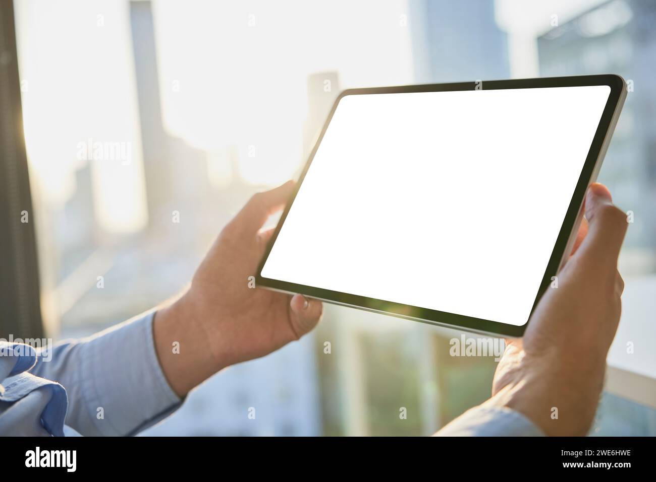 Hands of businessman holding tablet PC with blank screen Stock Photo ...