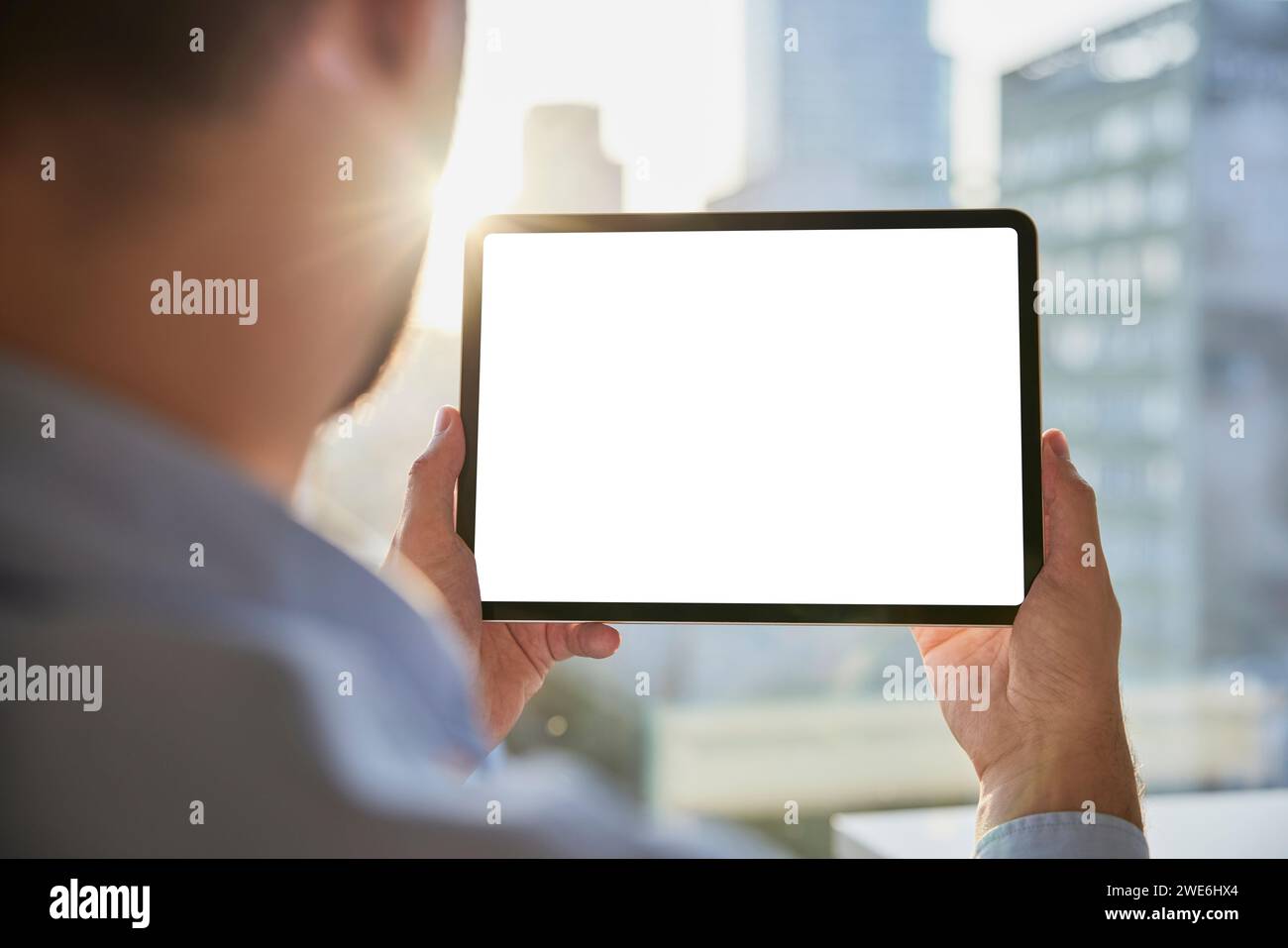 Businessman holding tablet PC with blank screen Stock Photo