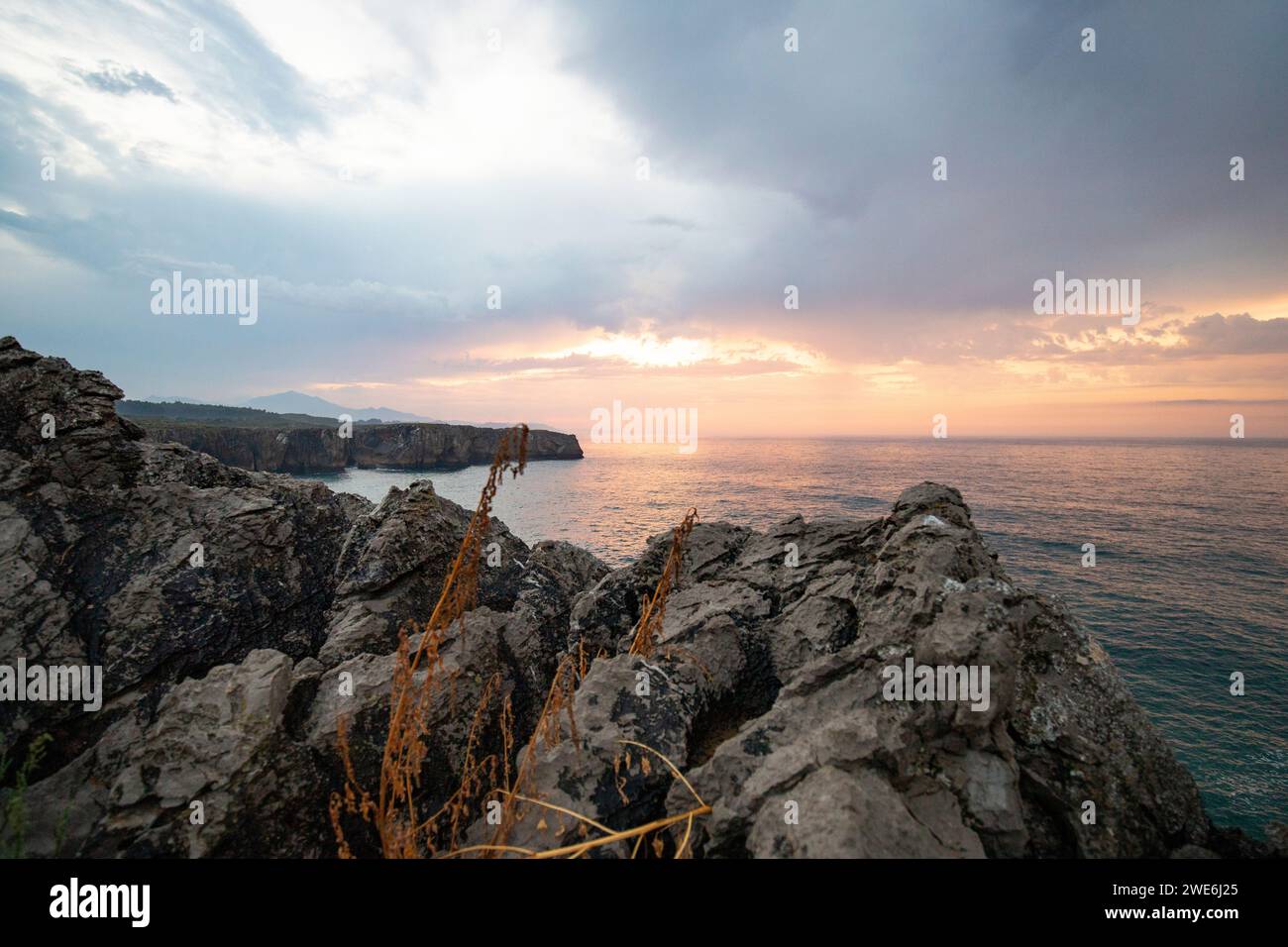 Rocky coastline in Playa De Las Catedrales, Asturias, Spain at sunset Stock Photo