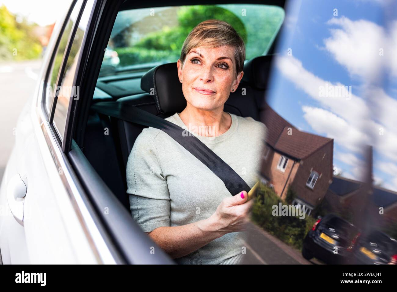 Woman in front seat of car hi-res stock photography and images - Alamy