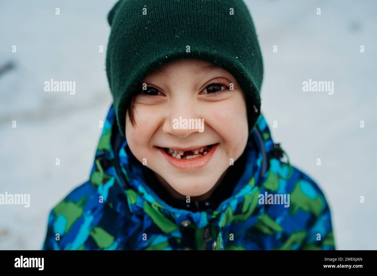 Happy boy wearing knit hat in winter Stock Photo