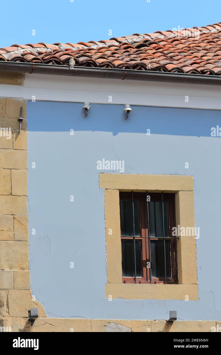 260 Barred window on blue wall, Ottoman building on Rrugica Jovan Spiro Kosturi street, Old Bazaar -Pazari i Vjeter- area. Korca-Albania. Stock Photo