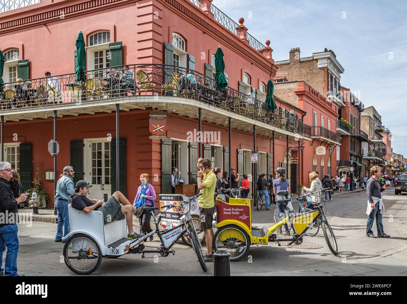 Bike taxi drivers wait for passengers in front of Dickie Brennan's Tableau restaurant on Jackson Square in the French Quarter of New Orleans, Louisana Stock Photo