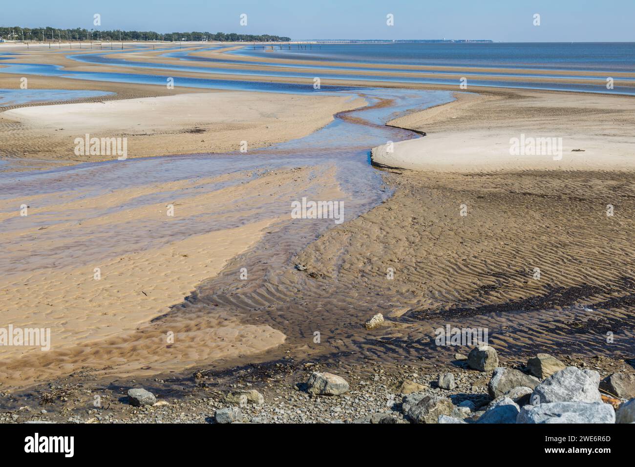 Sand beach exposed in bands during low tide of the Gulf of Mexico at