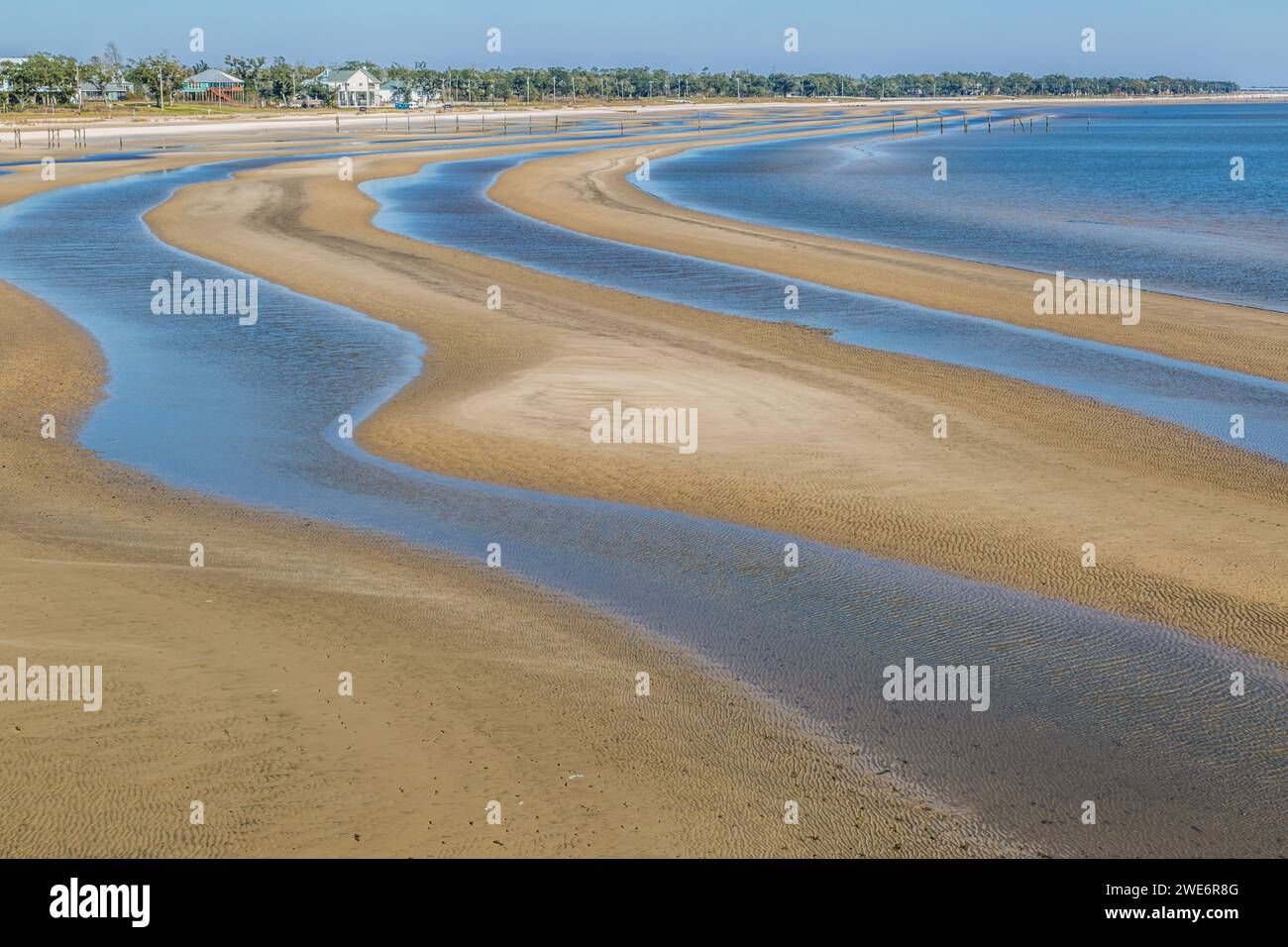 Sand beach exposed in bands during low tide of the Gulf of Mexico at