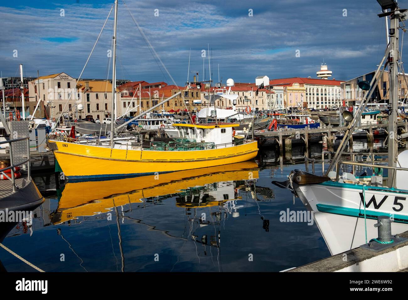 Fishing boats and old warehouse buildings on the Hobart waterfront, in Tasmania Stock Photo