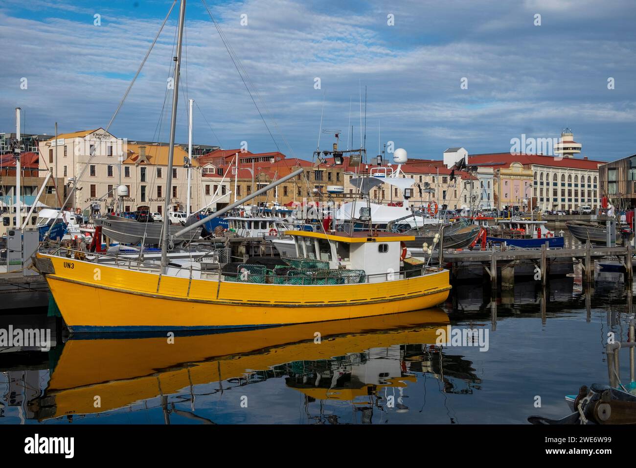 Fishing boats and old warehouse buildings on the Hobart waterfront, in Tasmania Stock Photo