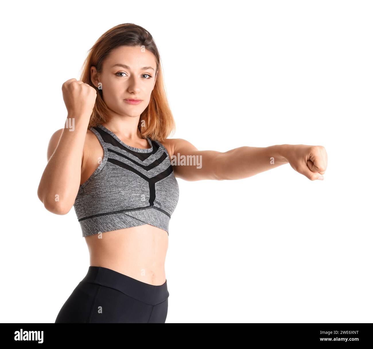 Young woman training on white background. Concept of self defense Stock ...