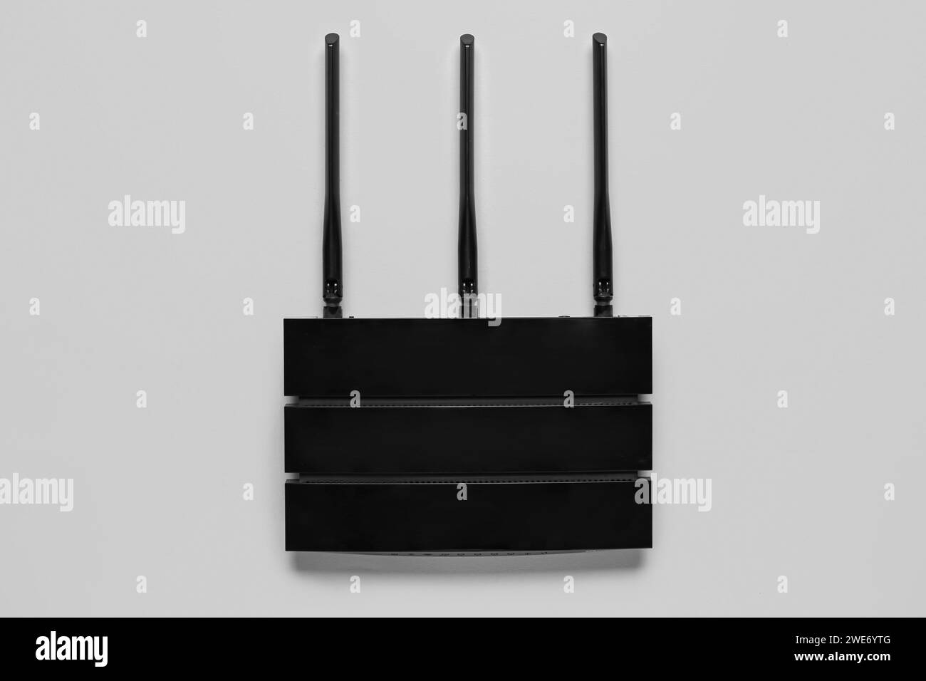 Grayscale Image For Router Modern wi-fi router on grey background Stock Photo - Alamy