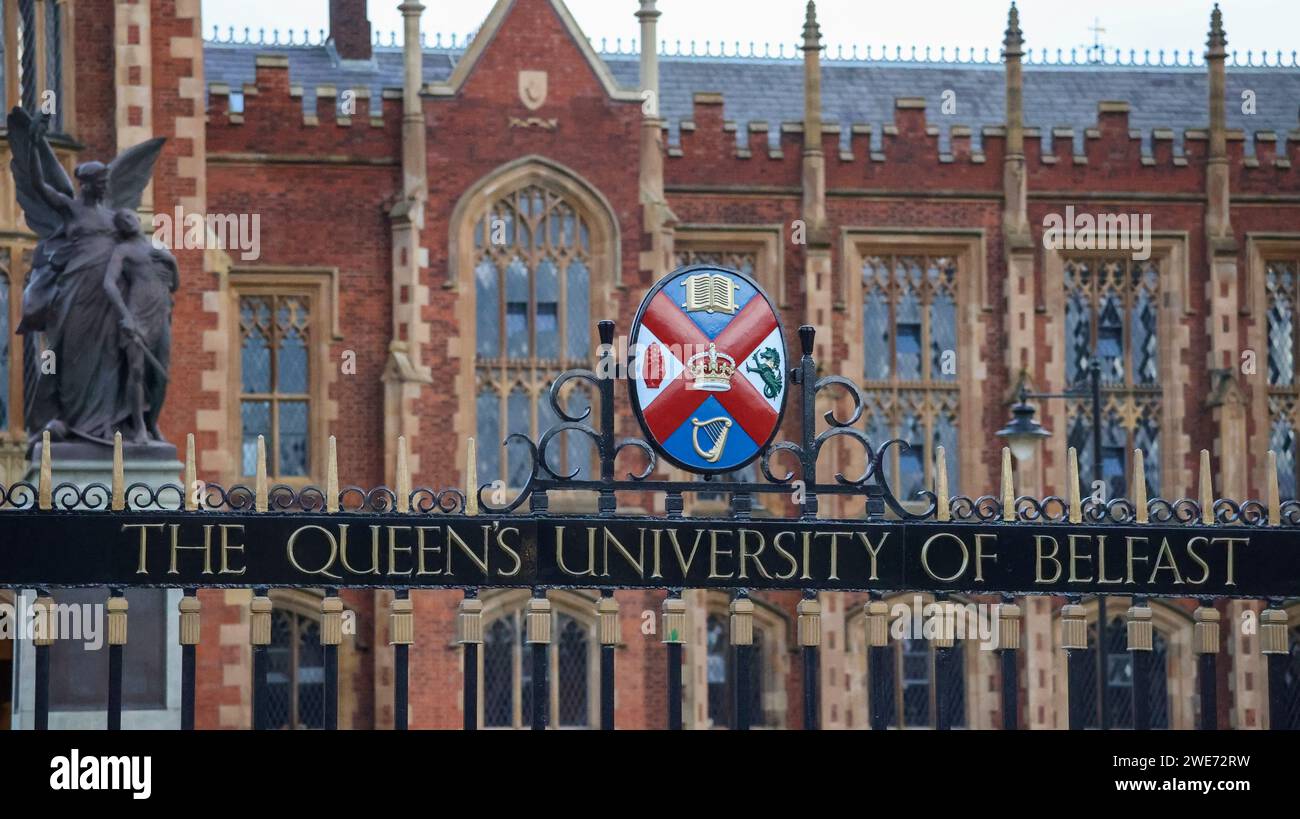 Ornate wrought iron gate with name amd coloured Queen's University coat of arms at Queen's University Belfast, Northern Ireland. Stock Photo