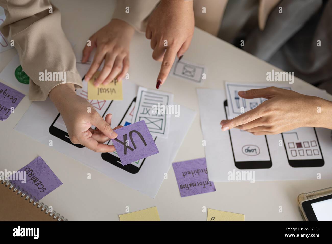 Group graphic designers brainstorming hi-res stock photography and ...