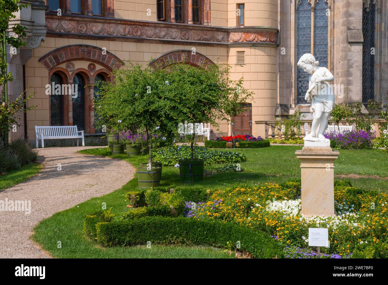 Castle garden with white marble sculpture The Allegory of Water or Boy