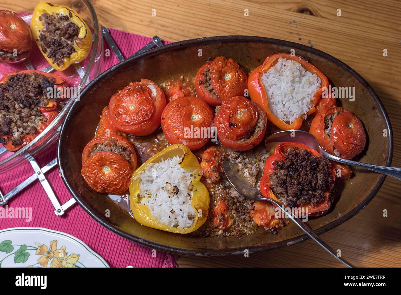 Stuffed tomatoes and peppers with rice and minced meat in a casserole on the table, Bavaria, Germany Stock Photo