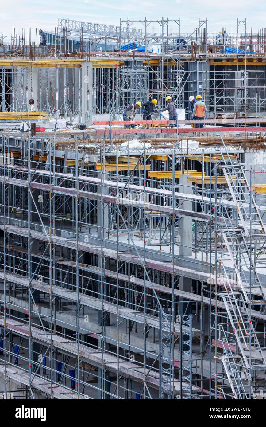 Construction worker on a large building site, Eschborn, Hesse, Germany Stock Photo