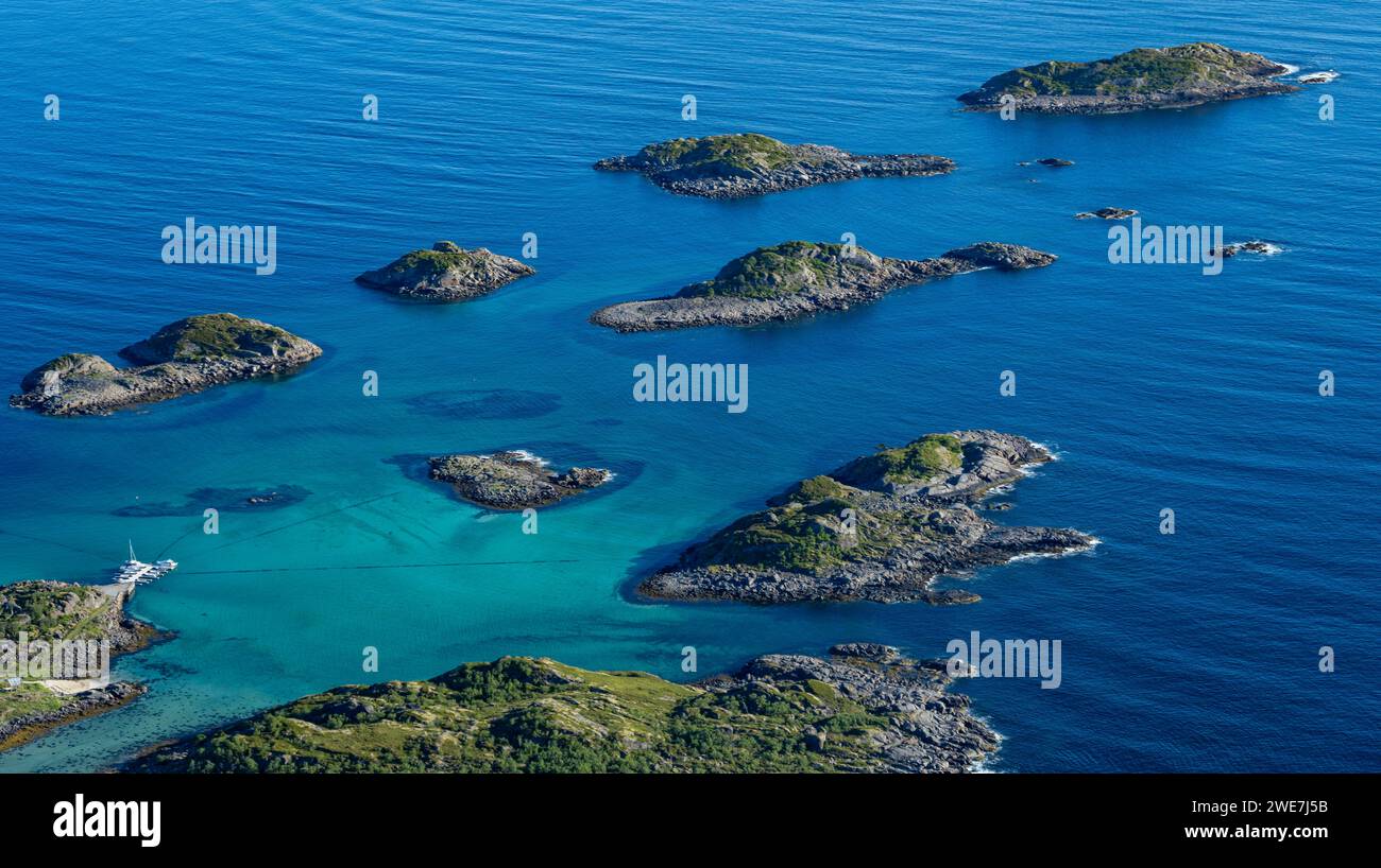 Coast and rocky islands in the blue sea, sea with archipelago islands, Ulvagsundet, Vesteralen, Norway Stock Photo