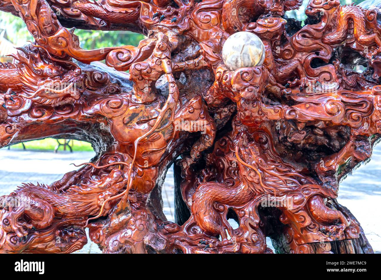 Wooden body carved with abstract dragon shape is displayed in the park during the Lunar New Year 2023 Stock Photo