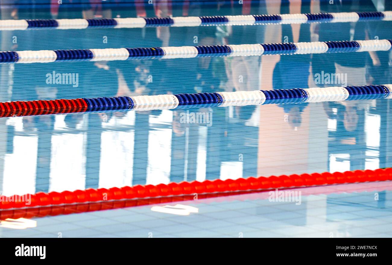 Dividing ropes delimit swimming lanes in the swimming pool of the ...