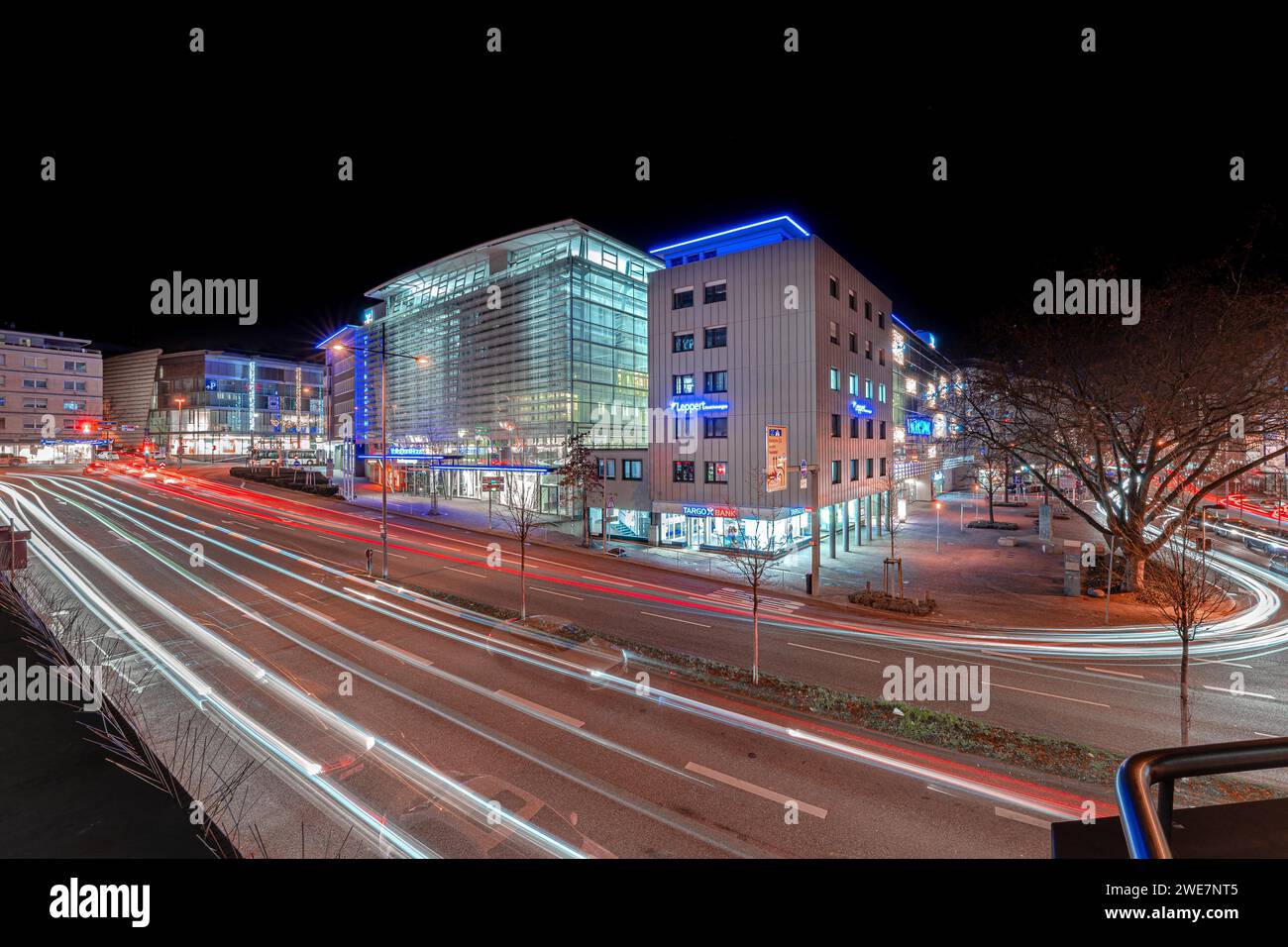 Long exposure of a busy intersection at night with light trails of vehicles, Pforzheim, Germany Stock Photo