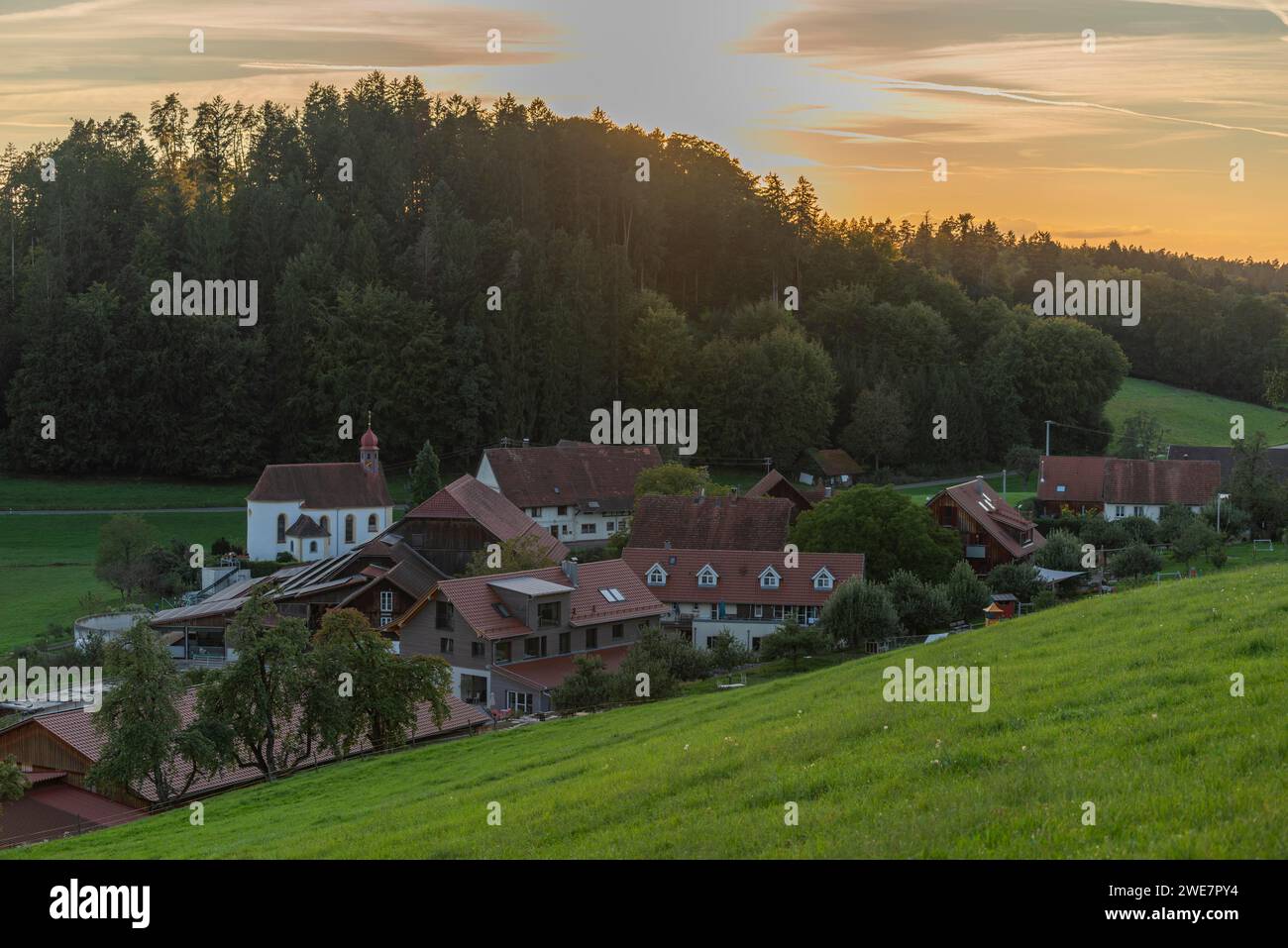Kressbronn am Bodensee, district Nitzenweiler, Hofgut Schleinsee, chapel, forest, hill, sunset, Baden-Wuerttemberg, Germany Stock Photo