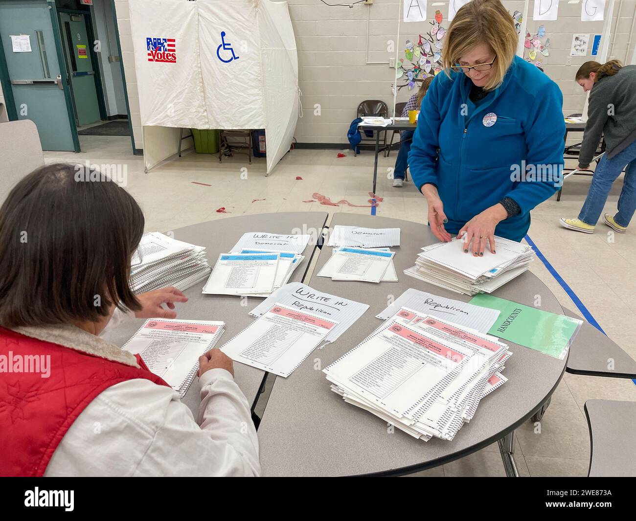 Nashua, New Hampshire, USA. 23rd Jan, 2024. Election workers sort the