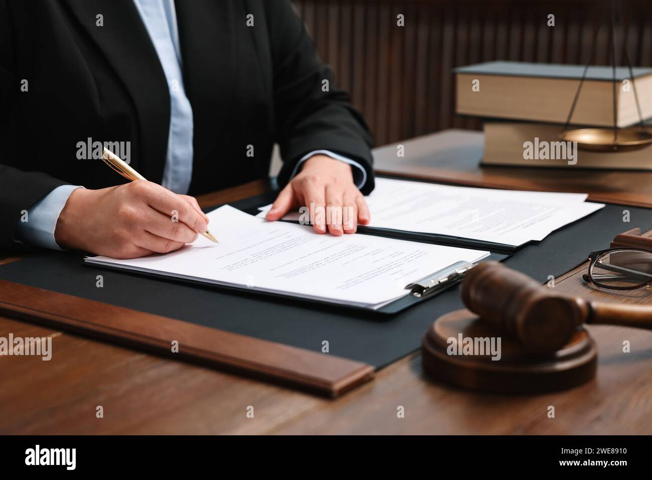 Lawyer working with documents at wooden table indoors, closeup Stock ...
