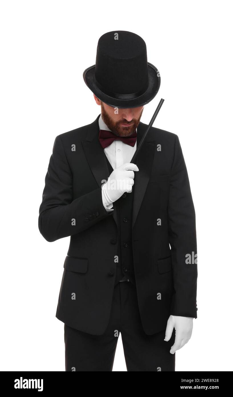 Magician in top hat holding wand on white background Stock Photo - Alamy