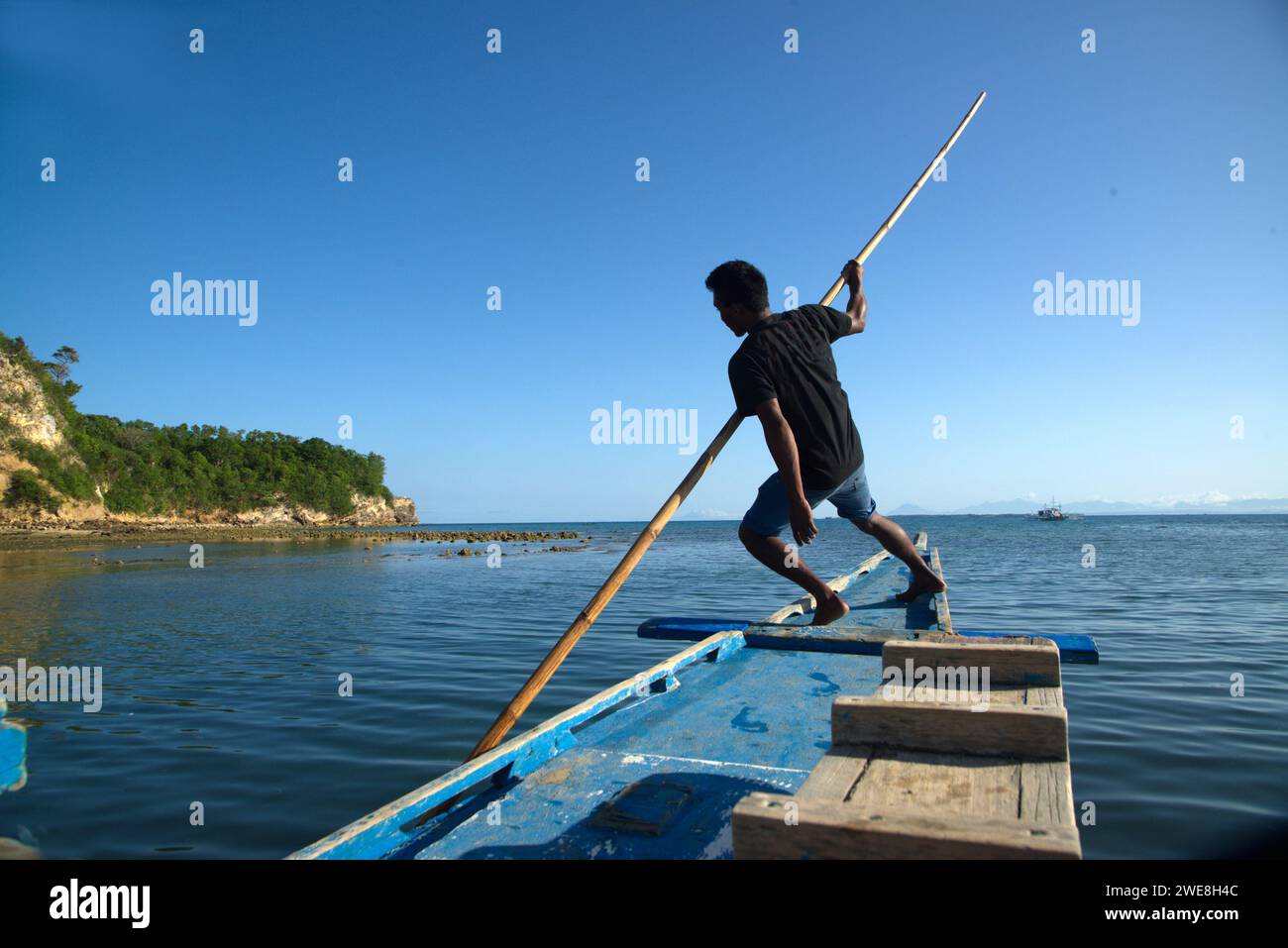 People used bamboo poles to push into the ground to make the ship move forward. Stock Photo