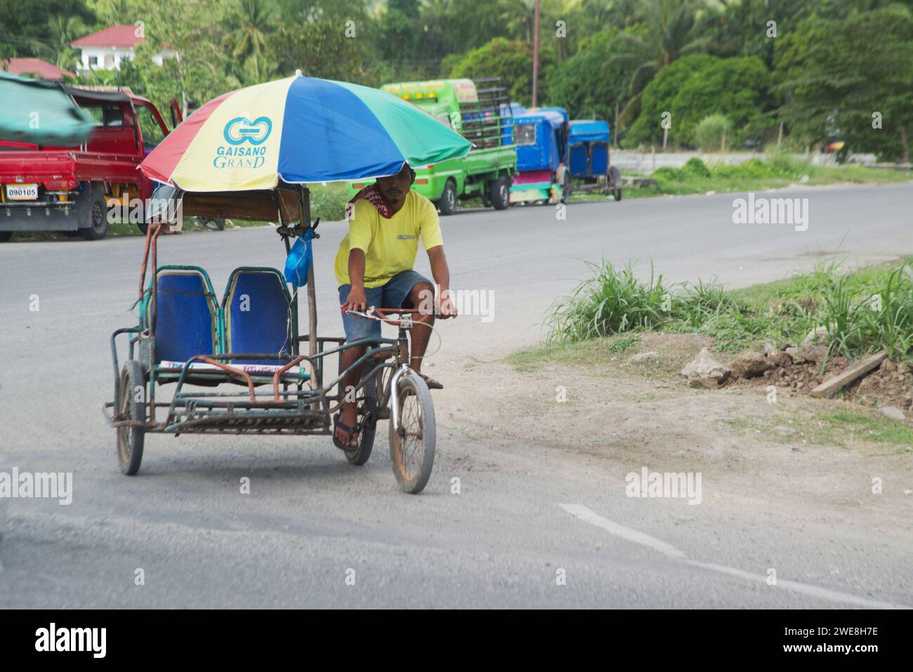 Cebu , Philippines - January 27,2020 :  Three wheel pedicab with bicycle sidecar It can be seen in the countryside of the Philippines. Stock Photo